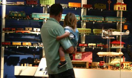 Dad And Daughter With Toy Trains
